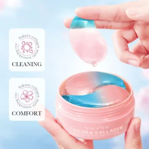 Hand lifting a dual-toned pink and blue SADOER Sakura Collagen Eye Mask patch from its jar.