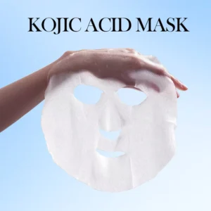 A hand holding an essence-rich SADOER Kojic Acid Face Sheet Mask for a brighter complexion.
