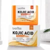 SADOER Kojic Acid Soap Bar resting on its white and orange product packaging box.