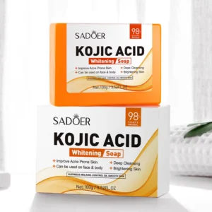 SADOER Kojic Acid Soap Bar resting on its white and orange product packaging box.
