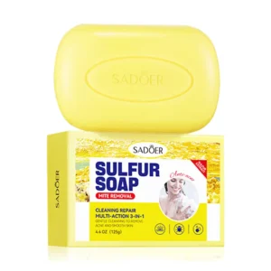 SADOER Sulfur Soap Bar resting on its yellow packaging for acne-prone skin deep cleansing.
