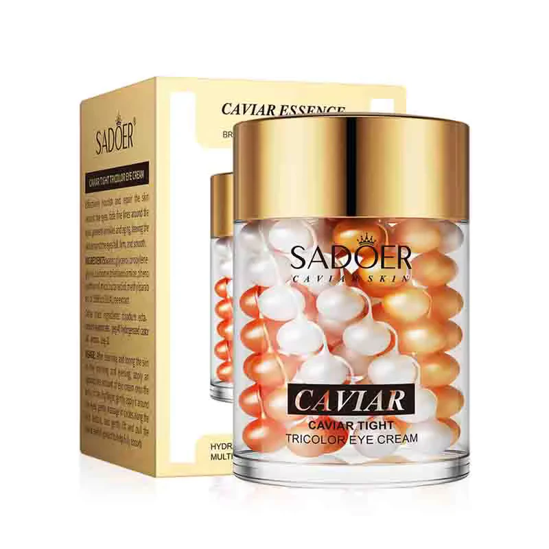 SADOER Caviar Tricolor Eye Cream jar with multi-colored pearls next to its gold packaging box.