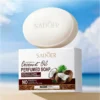 SADOER Coconut Oil Soap Bar and packaging displayed against a bright tropical beach background.
