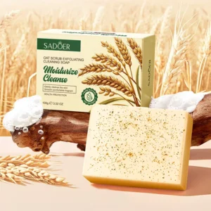 SADOER Oat Exfoliating Soap Bar and packaging displayed with natural wheat and rustic wood.