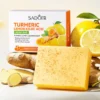 SADOER Turmeric Soap Bar and box displayed with fresh lemon and turmeric root ingredients.