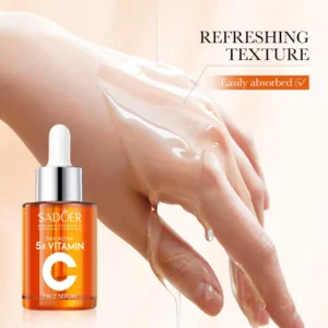 SADOER Vitamin C Face Serum being applied to a hand, demonstrating its clear, refreshing texture.