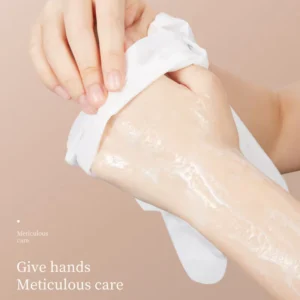Applying the moisturizing SADOER Damask Rose Hand Mask to hydrate and soften dry hands.