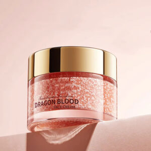 Gold-lidded SADOER Dragon Blood Face Cream jar displaying its textured pink moisturizing formula.