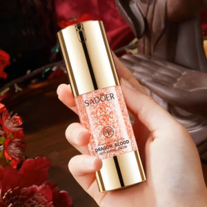 Hand holding SADOER Dragon Blood Anti-Ageing Face Cream bottle showing the light cream texture.